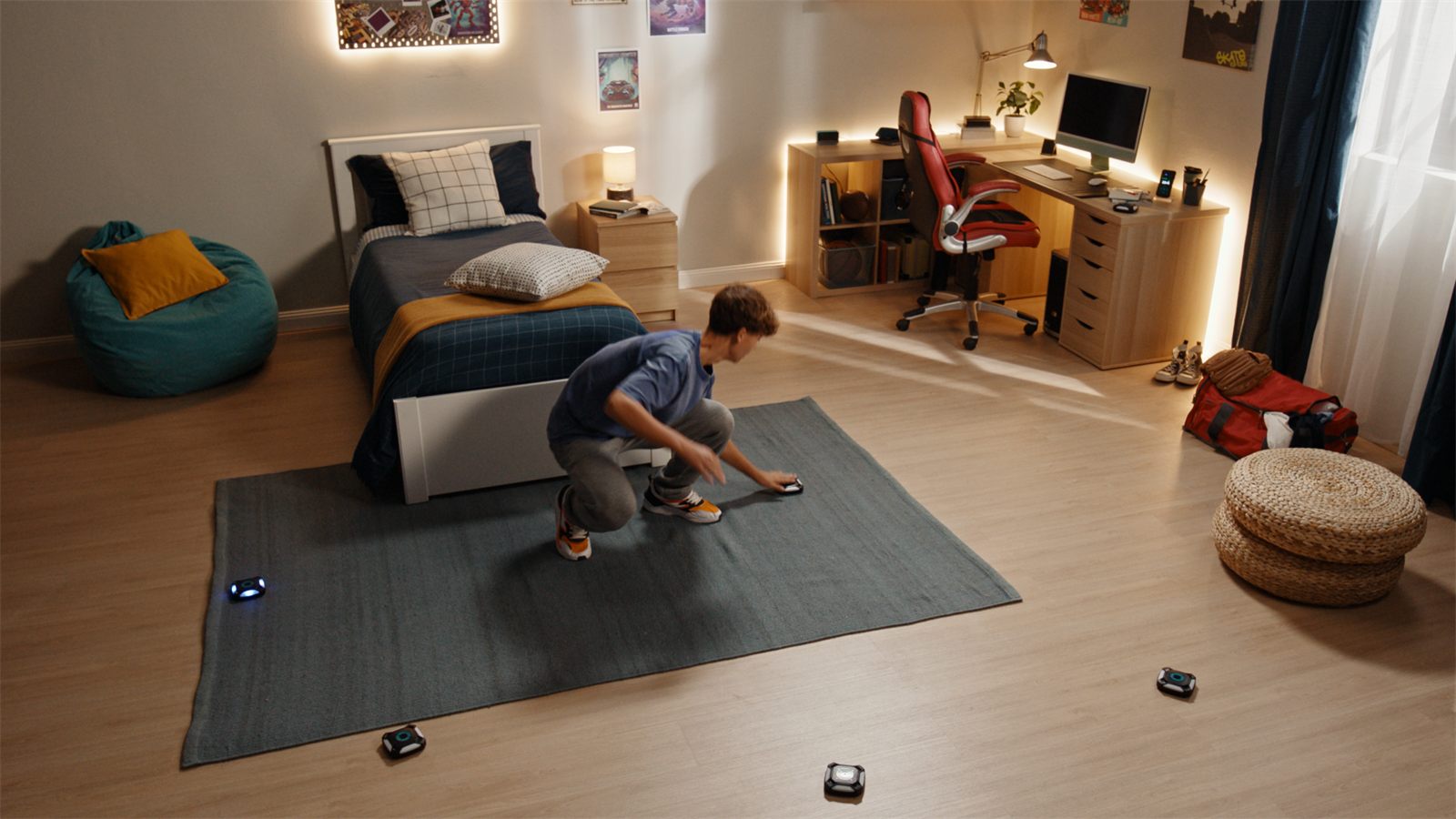 Teen playing ActivePod on the bedroom floor