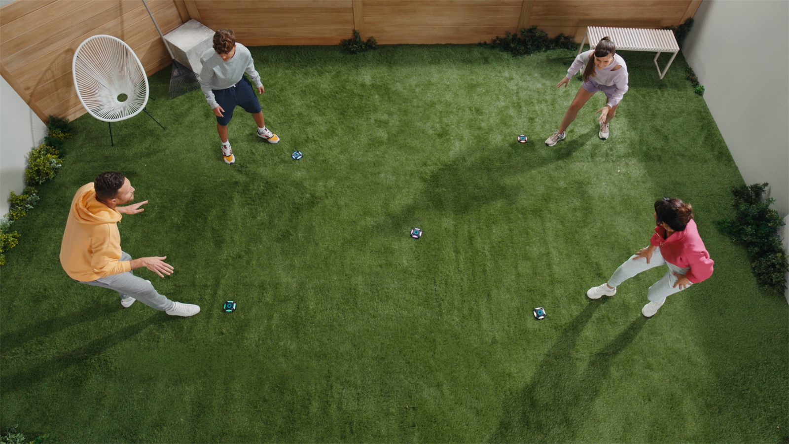 Group of friends playing ActivePod in a garden